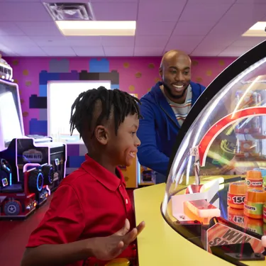 Dad and Son in Hotel Arcade
