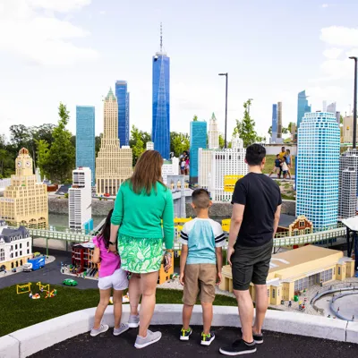 Family looks at New York MINILAND