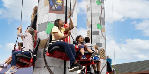 Guests hoist themselves to the top of Tower Climb